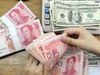 IMF nâng tỷ trọng USD, đồng nhân dân tệ vào rổ SDR