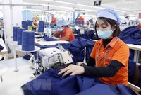 Sản xuất hàng dệt may. (Nguồn: TTXVN).