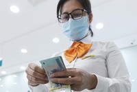 Nhu cầu vay vốn của các doanh nghiệp tăng dần sau khi bị gián đoạn kinh doanh do dịch bệnh Covid-19. Ảnh: Dũng Minh