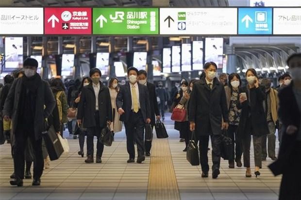 Người dân trên đường phố ở Tokyo (Nhật Bản), ngày 10/12/2020. (Ảnh: AFP/TTXVN).