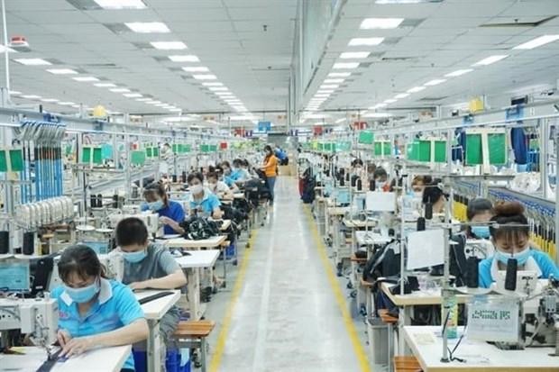 Công nhân làm việc tại TNHH may mặc Bowker Việt Nam, Khu công nghiệp Đồng An 1, thành phố Thuận An, tỉnh Bình Dương. (Ảnh: Chí Tưởng/TTXVN)